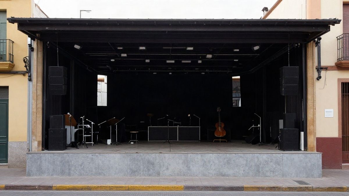 Imagen ilustrativa: interior de una sala de conciertos vacía con un escenario y algunos instrumentos